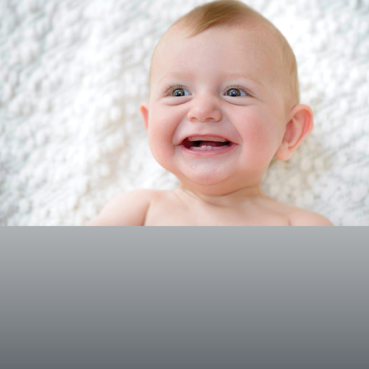 Baby with first tooth 